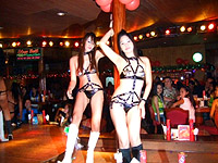 Filipina bar girls dancing on stage in Pony Tails club in Angeles City.