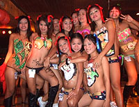 Sexy Filipina bar girls dancing at Pony Tails Club, Walking Street, Angeles City, Philippines.